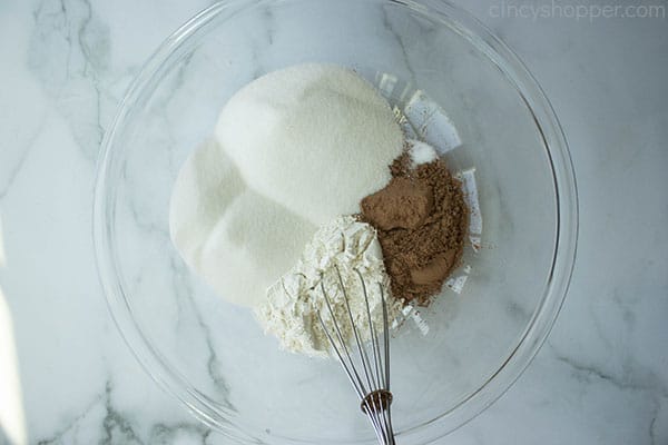 whisking flour, sugar, and cocoa in a bowl to make homemade brownies