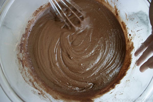 whisking chocolate in a bowl