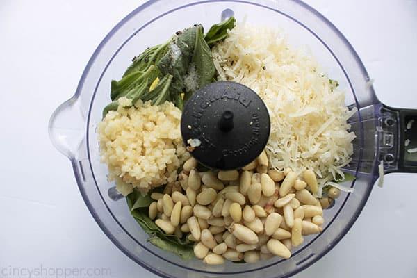 basil, garlic, pine nuts, and Parmesan in a food processor