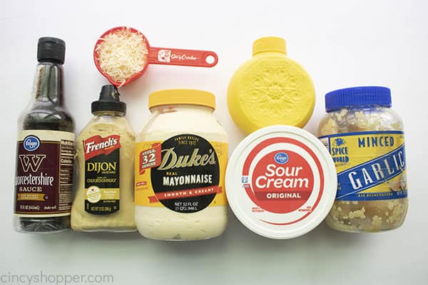 ingredients for dressing on a white board.