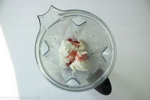 Vanilla Ice Cream, lemonade and strawberry sauce in a blender