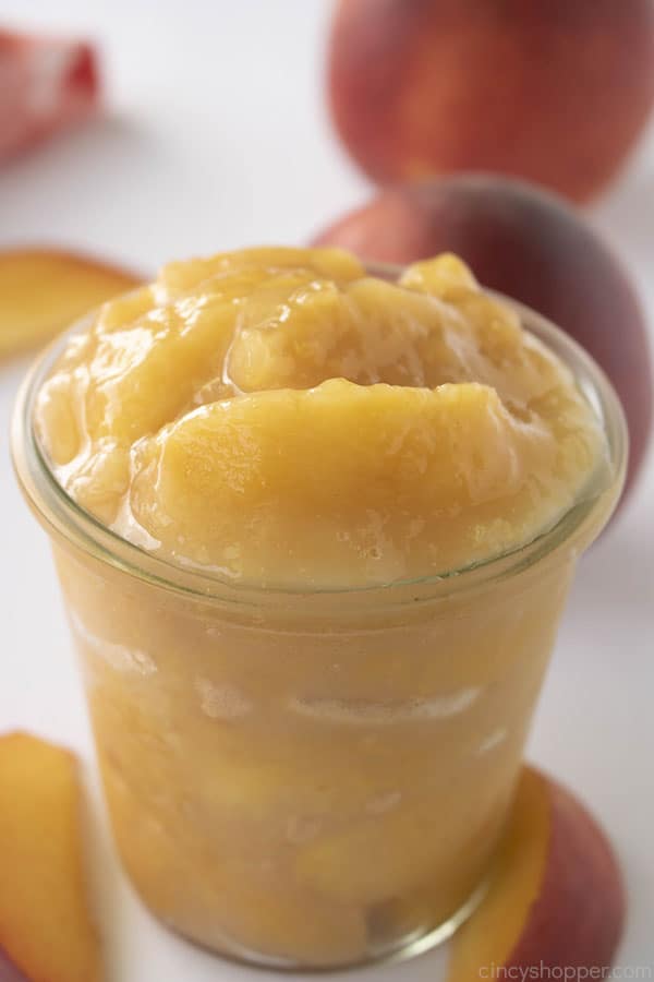 Fresh Peach Filling in a clear glass jar with white background