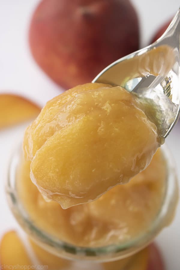 Homemade Peach Pie filling on a spoon