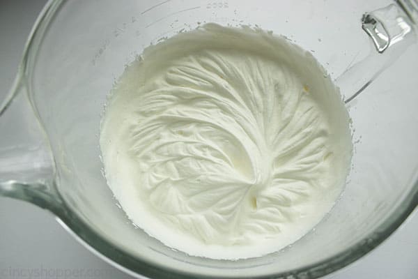 Whipped heavy whipping cream in a large bowl