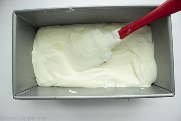 Ice Cream mixture in loaf pan with a spatula