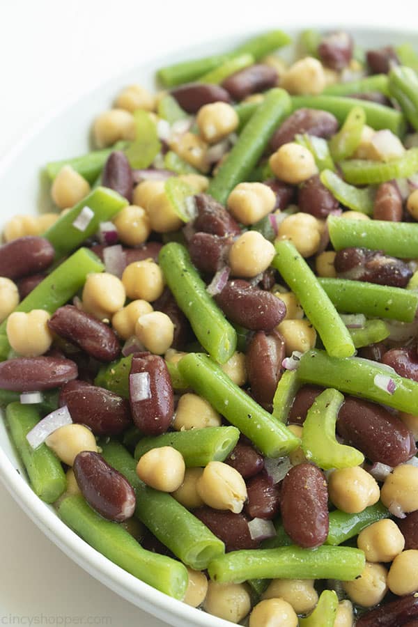 Three bean salad in a white bowl