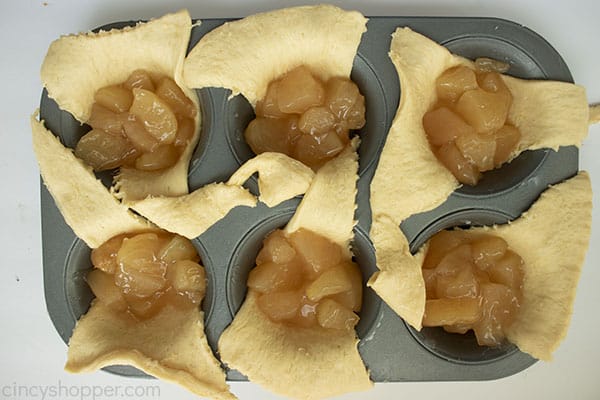 Apple pie filling inside crescent rolls.