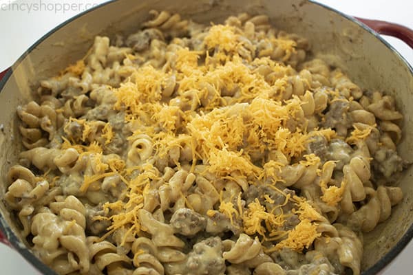 Mixed Cheeseburger Hamburger Helper topped with shredded sharp cheddar cheese 