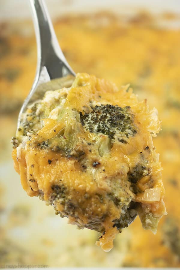 Lifted spoon with broccoli cheese casserole