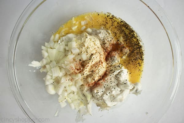 Wet ingredients in a clear bowl with a white background