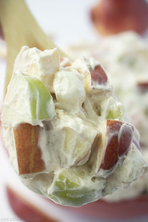 Close shot of the Creamy Apple Salad on a wooden spoon