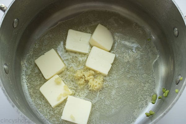 Butter and garlic in stainless steel saucepan.