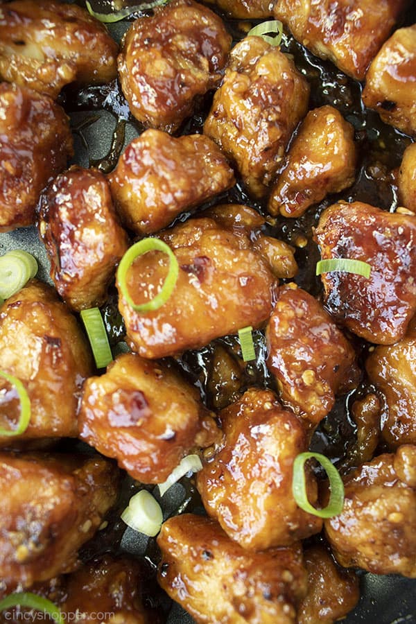 Closeup of sticky General Tso's Chicken in a pan.