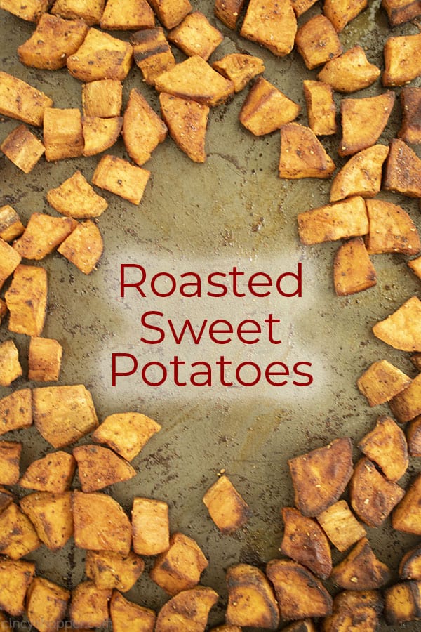 Text in middle of image Roasted Sweet Potatoes on a sheet pan. 