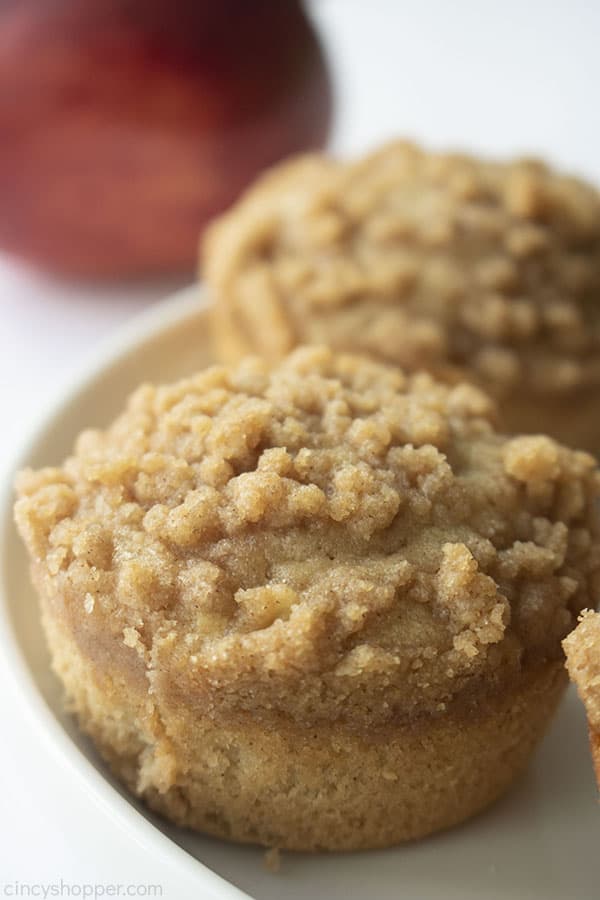 Apple Muffins on a white plate with red apple in background