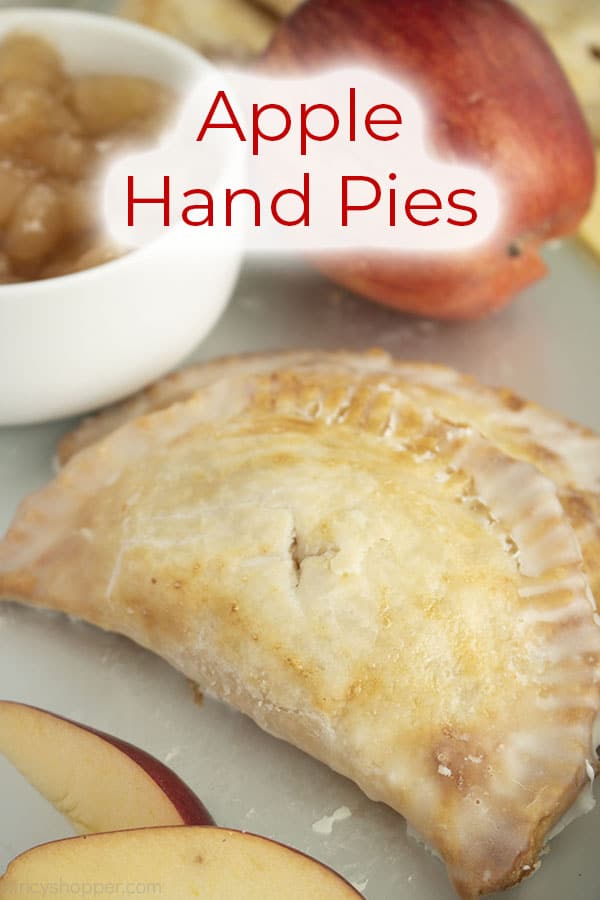 Text on image Apple Hand Pies on a pan with apple slices, red apple and bowl of apple pie filling.