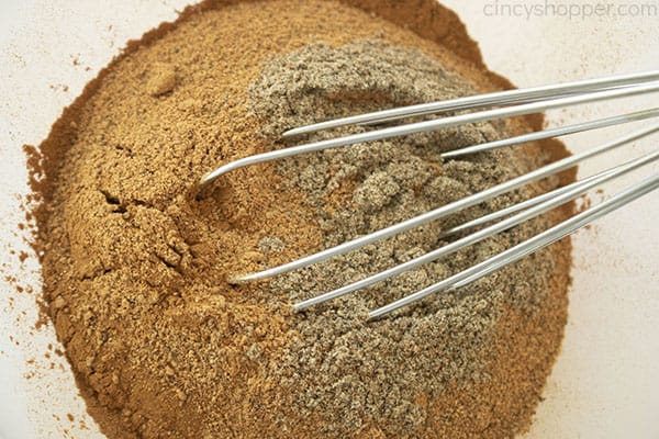 Apple Pie spices in a clear bowl with a whisk