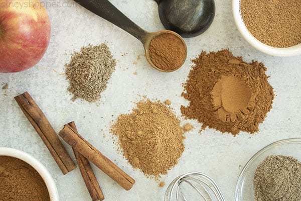 Homemade Apple Pie Spice with ingredients on a gray background