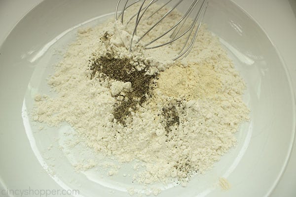 spice mix in a white bowl with a whisk