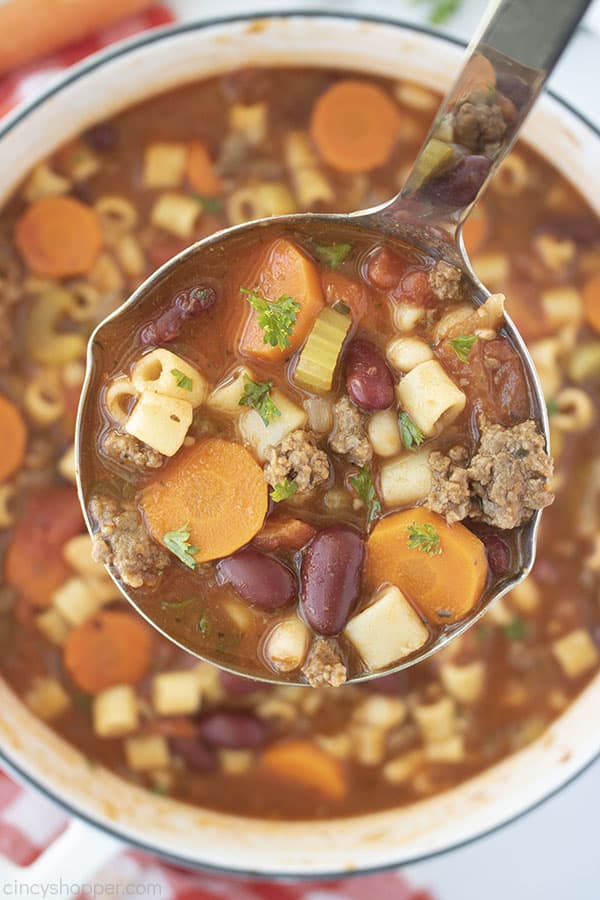 Pasta Fagioli soup in a ladle overhead shot