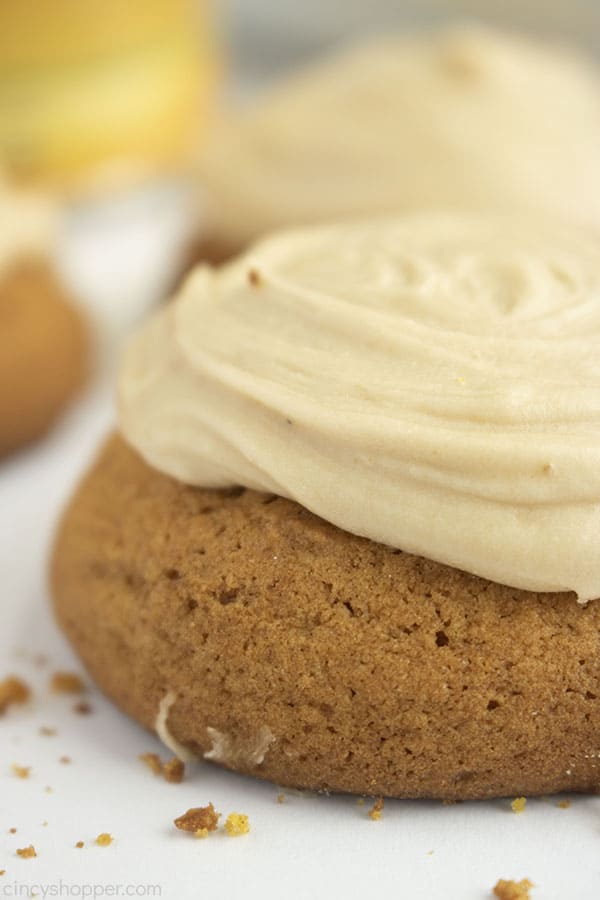 Closeup of Pumpkin Cookies with brown butter frosting on a white background