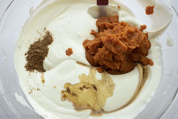 Pumpkin and spices added to whipped cream mixture