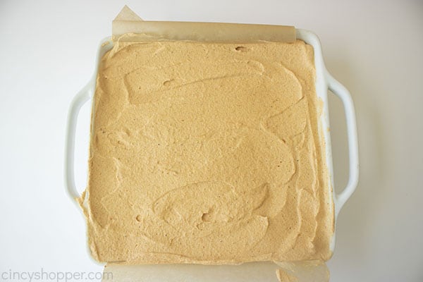 Overhead photo of the finished Pumpkin Icebox Cake before freezing in a square white pan 