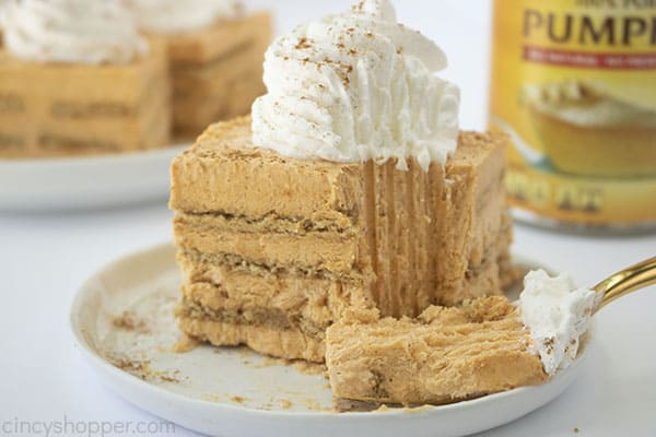 Close up shot of a plated slice of No Bake Pumpkin Icebox Cake with a silver fork 