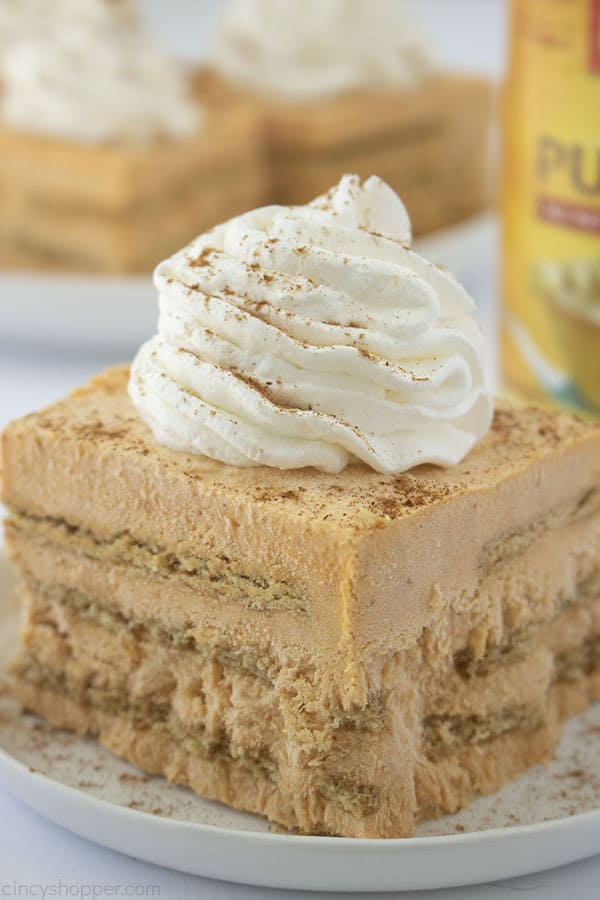 Close up plated image of No Bake Pumpkin Icebox Cake with slices in the background