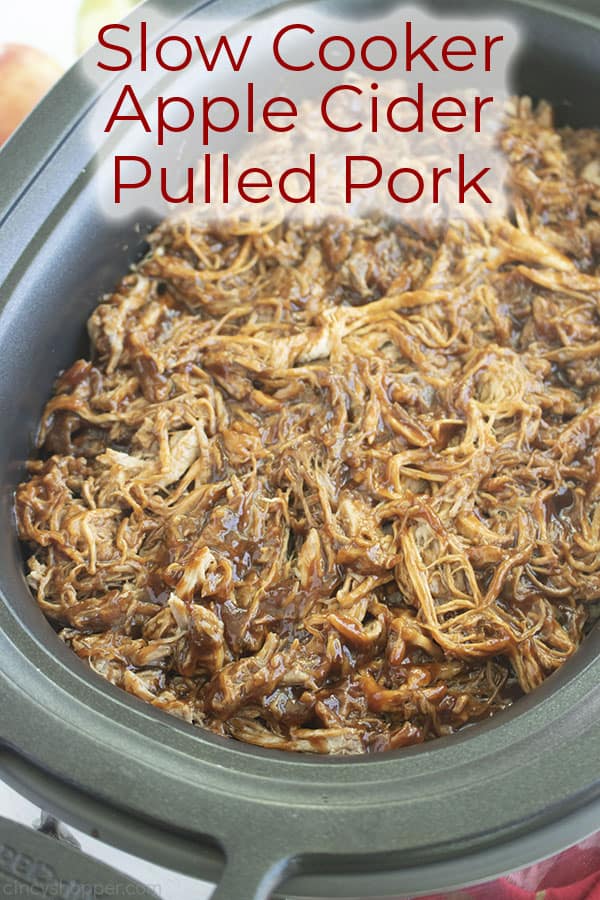 Long pin image of the Pulled Pork in a black oval slow cooker titled Slow Cooker Apple Cider Pulled Pork in red 