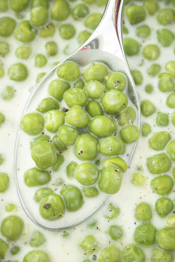 Closeup of creamy peas on a spoon