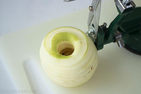 Peeled, cored and sliced green apple