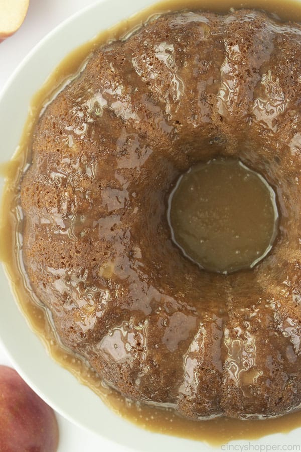 Overhead of baked apple cake with caramel glaze.