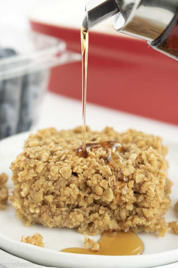 Syrup pouring on piece of baked oatmeal