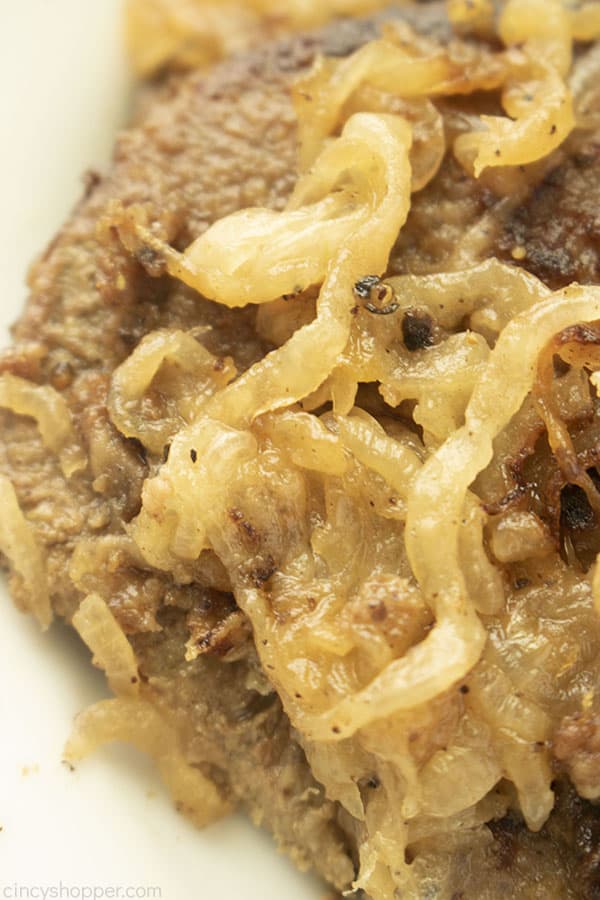 Overhead closeup of liver smothered in onions.
