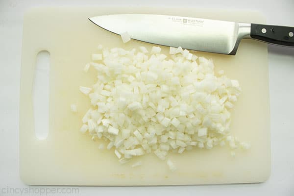 Diced onions on a cutting board.