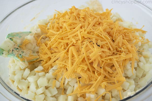 Cheese added to mixing bowl