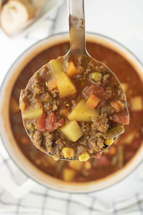 Ground Beef Soup with vegetables on a ladle 