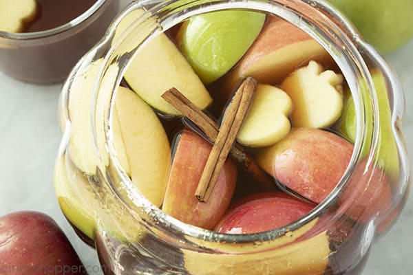 Apple cider in a clear punch bowl