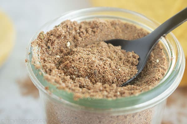 Taco seasoning mix in a jar with spoon