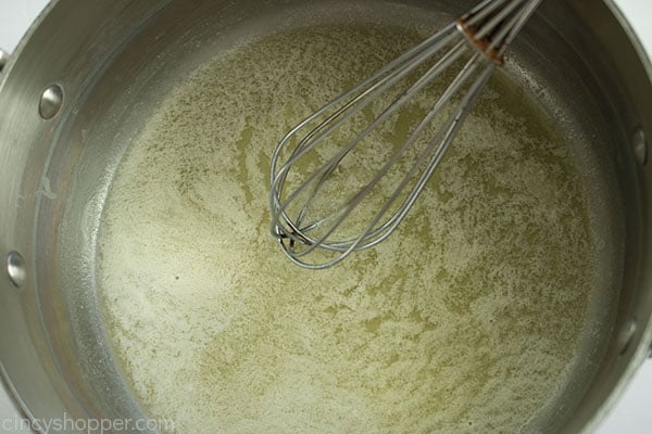 Butter melted in pan with a whisk