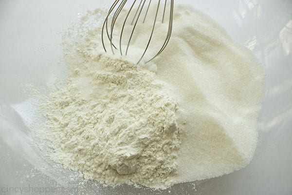 Dry ingredients in a clear bowl with whisk