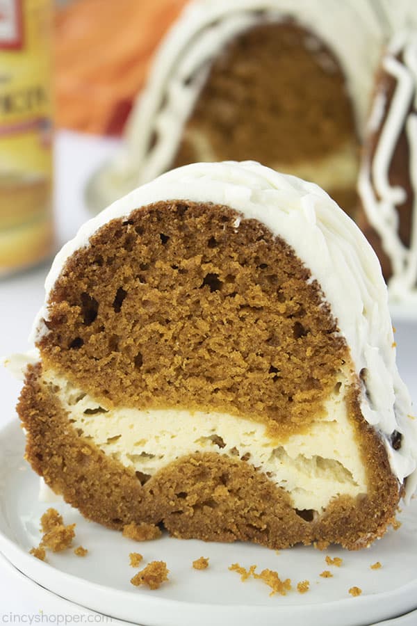 Slice of Pumpkin Cream Cheese Cake on a plate.