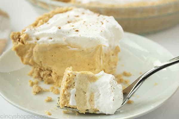 Fluffy pumpkin pie on a fork