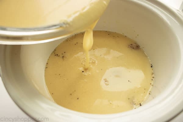 Gravy mixture being added to Crock Pot