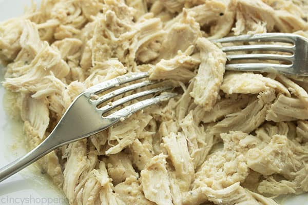 Shredding chicken with two forks