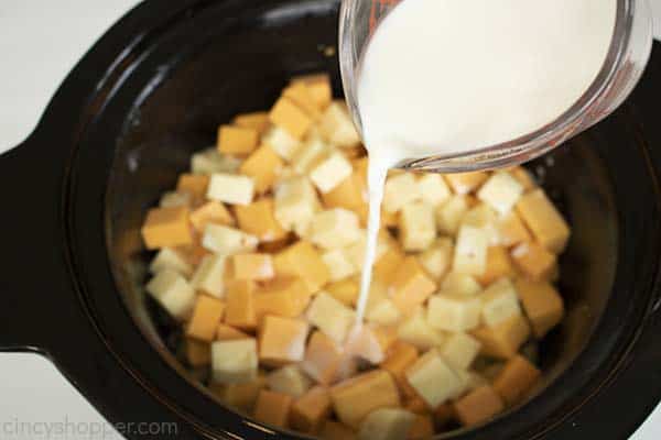 Milk being poured on cheese