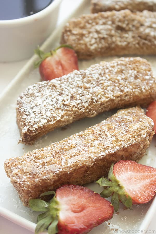 Air Fryer French Toast sticks with cinnamon sugar on a platter