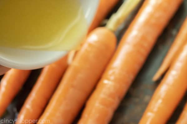 Adding butter to roasted carrots