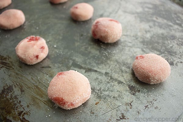 Cookie dough balls on baking sheet